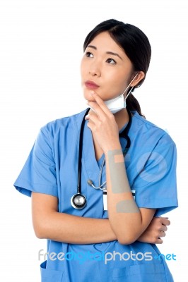 Female Surgeon Thinking Something Stock Photo