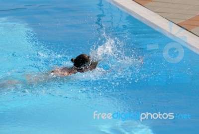 Female Swimming The Crawl Stock Photo