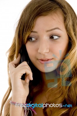 Female Talking Over Cellphone Stock Photo