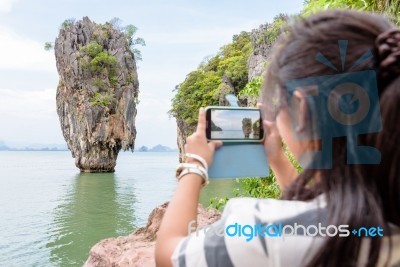 Female Traveler Shooting Natural View By Mobile Phone Stock Photo