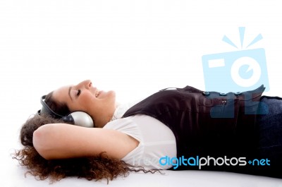 Female Tuned Into Music Stock Photo