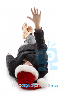 Female Wearing Christmas Hat And Showing Palms Stock Photo