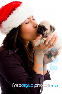 Female With Hat And Kissing Puppy Stock Photo