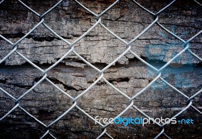 Fence And Grunge Wall Stock Photo