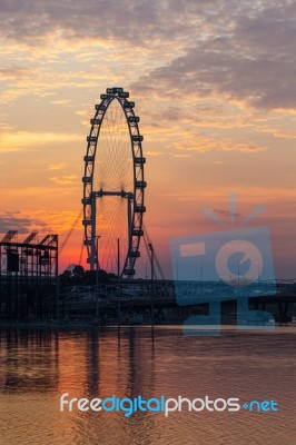 Ferris Wheel With Sunrise Stock Photo