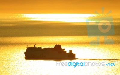 Ferry At Sunset Stock Photo