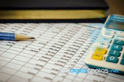 Financial Data Table And Calculator Stock Photo