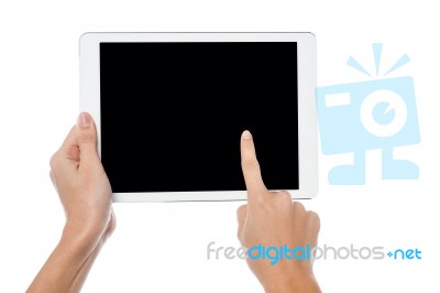 Finger Being Pointed On Tablet Screen Stock Photo