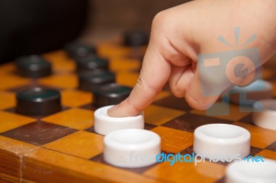 Finger Moves The Piece To The Chessboard Stock Photo