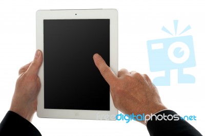 Finger Of A Man On Tablet Pc Screen, Closeup Shot Stock Photo