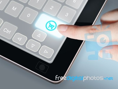 Finger Pressing Buy Now Button Stock Photo