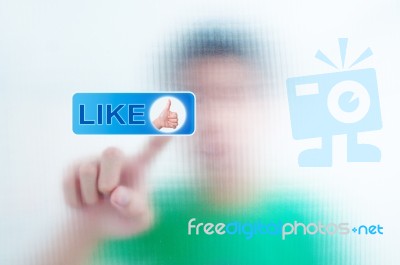 Finger Pressing Like Button Stock Image