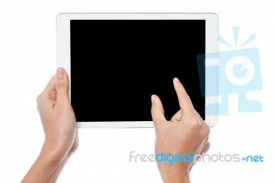 Fingers Being Pointed On Tablet Screen Stock Photo