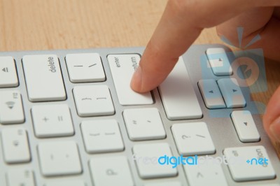 Fingers Typing On Keyboard In Close-up Stock Photo