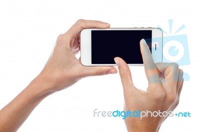 Fingers Zooming In On Cell Phone Stock Photo