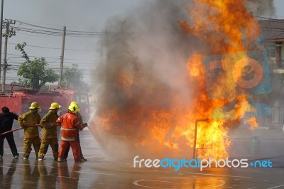 Fireman. Firefighters Fighting Fire During Training Stock Photo