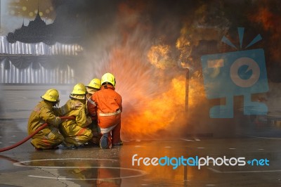 Fireman. Firefighters Fighting Fire During Training Stock Photo