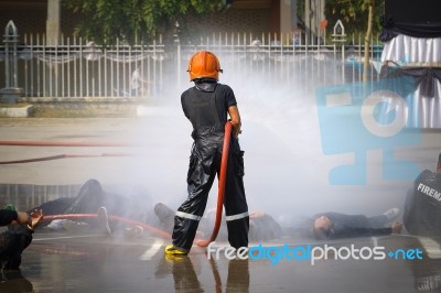 Fireman. Firefighters Fighting Fire During Training Stock Photo