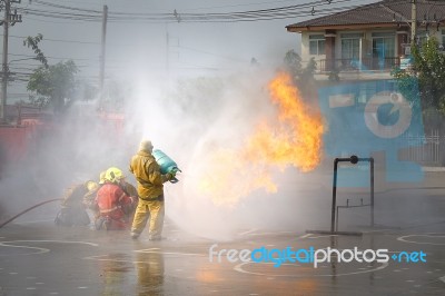 Fireman. Firefighters Fighting Fire During Training Stock Photo