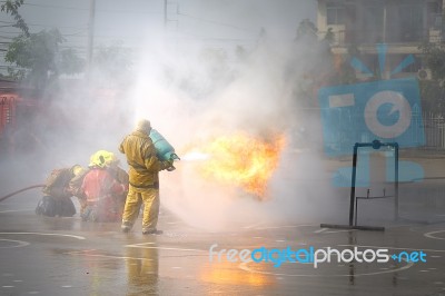 Fireman. Firefighters Fighting Fire During Training Stock Photo