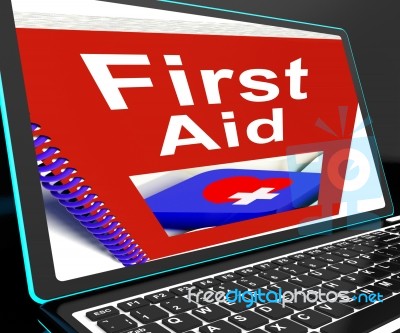 First Aid On Laptop Shows Medical Assistance Stock Image