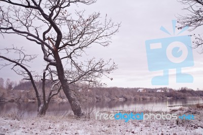 First Snow On The Riverbank. Autumn Morning Landscape Stock Photo