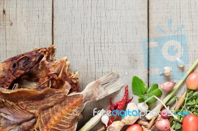 Fish And Curry On Wooden Stock Photo