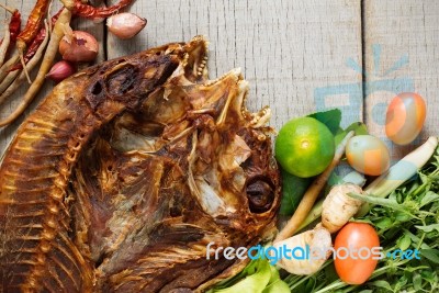 Fish And Curry On Wooden Stock Photo