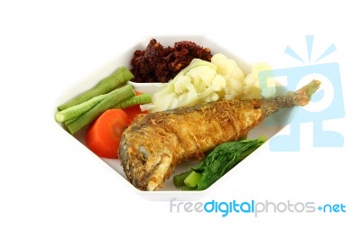 Fish Fried With Vegetables Stock Photo