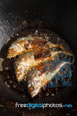 Fish Frying In Hot Oil Stock Photo