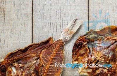 Fish On Wooden Floor Stock Photo