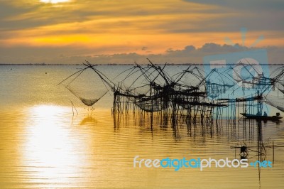 Fisherman And The Sea, Thailand Stock Photo