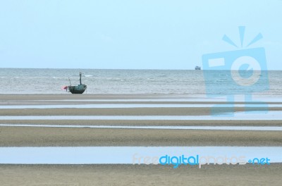 Fisherman Boat On Sand Beach Stock Photo