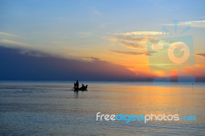 Fisherman Fishing Boat On Sea Stock Photo