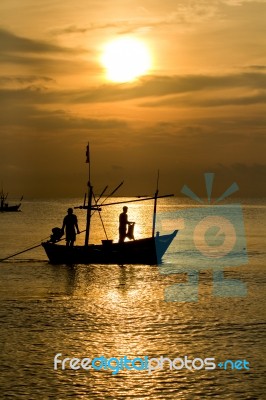 Fisherman Silhouette In Sea Stock Photo