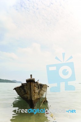 Fishing Boat Anchored On The Shore Stock Photo