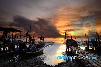 Fishing Boat With Sunrise Background Stock Photo