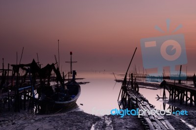 Fishing Boat With Sunrise Background Stock Photo