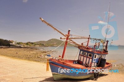 Fishing Boats Are Parked On The Beach Stock Photo