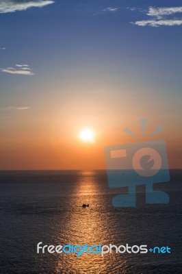 Fishing Boats At Sunset Silhouette Stock Photo