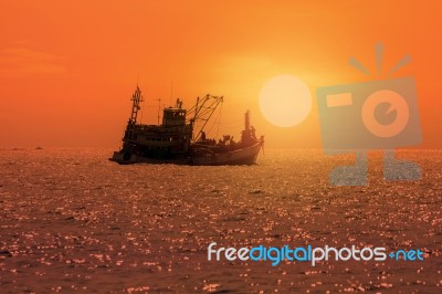 Fishing Boats Floating In The Sea Stock Photo