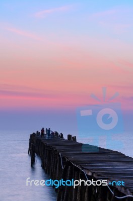 Fishing Pier At Sunrise Stock Photo