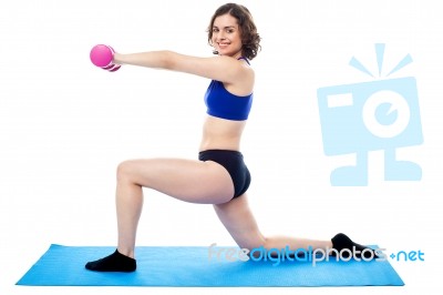 Fit Lady With Dumbbells Kneeling On One Leg Stock Photo