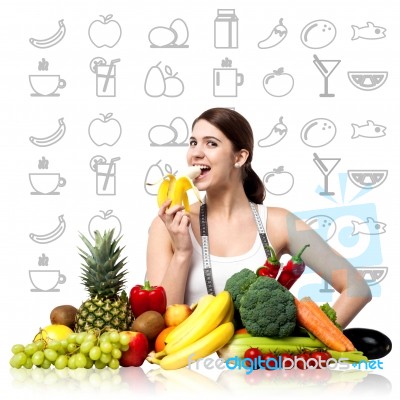 Fit Smiling Woman Enjoying Banana Stock Photo