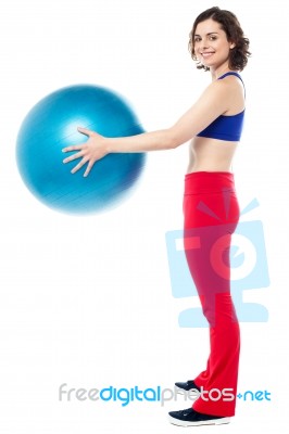 Fit Woman Posing With Big Blue Exercising Ball Stock Photo