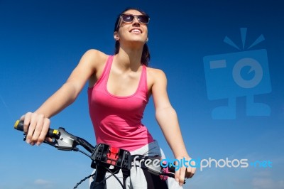 Fit Woman Riding Mountain Bike Stock Photo