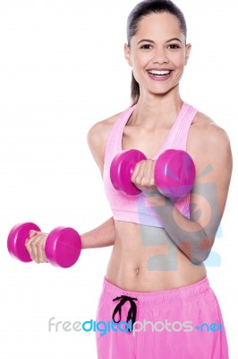 Fit Woman Working Out With Dumbbells Stock Photo