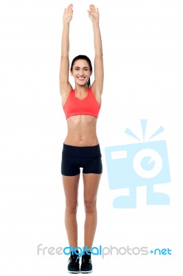 Fitness Enthusiast Stretching Her Arms Stock Photo