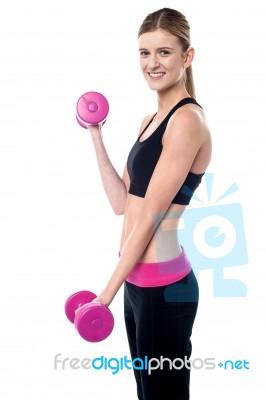 Fitness Female Instructor Lifting Dumbbells Stock Photo