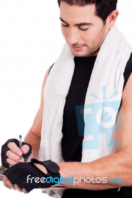 Fitness Man Marking Notes Stock Photo